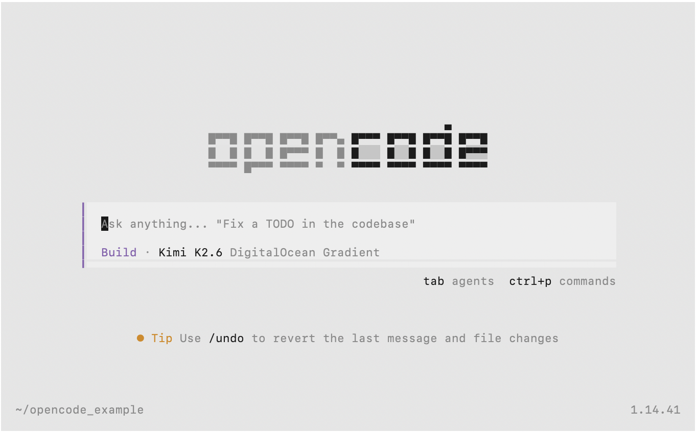 The OpenCode terminal user interface showing a split-pane layout with a conversation panel on the left displaying the agent's responses and file edits, and a scrollable session view, with a prompt input field at the bottom for entering coding tasks